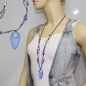 Mobile Preview: Halskette Kunststoffperlen blau transparent silberfarben Faustkeil Kordel blau 90cm