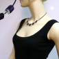 Preview: Halskette Schrägperle Kunststoff lila-seidig und kristallklar-transparent Vollgummi schwarz 45cm